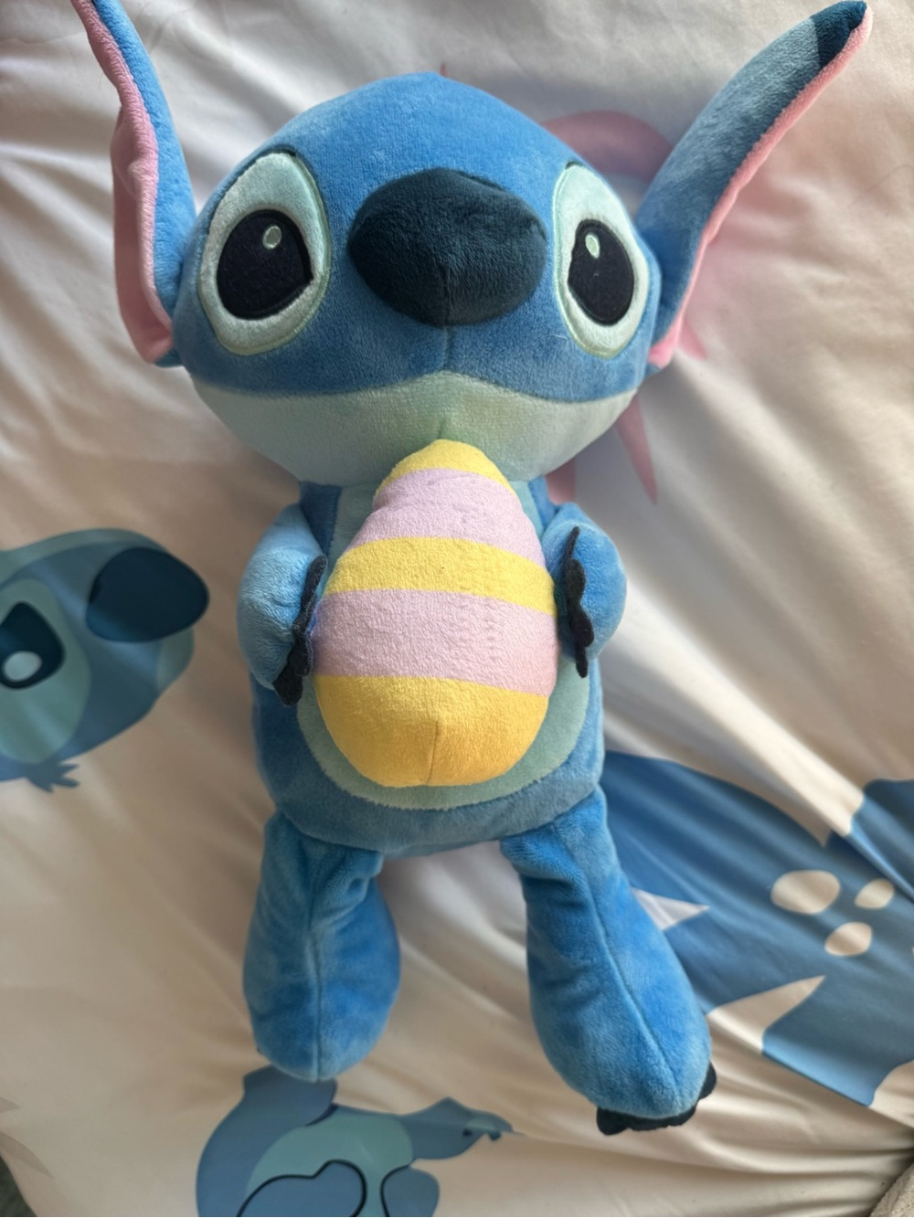 Disney Stitch Plush Holding Pastel Yellow & Pink Egg